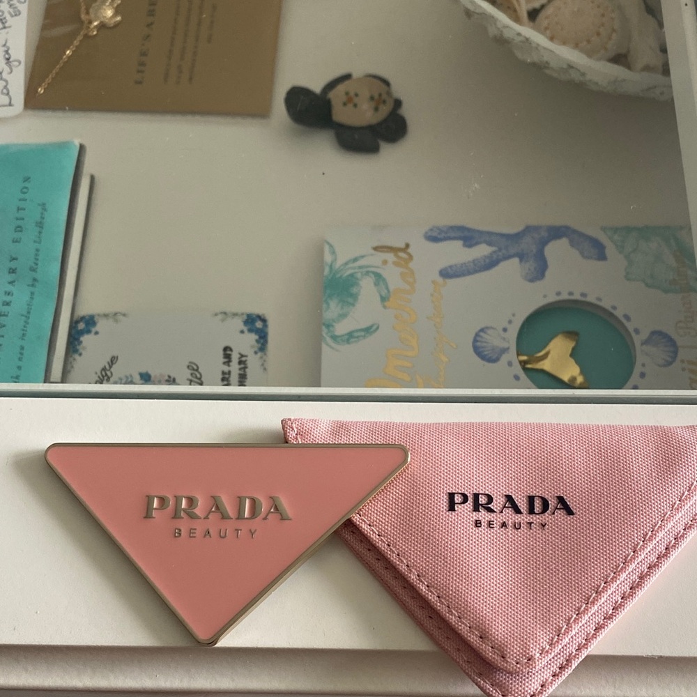 Prada Beauty Pink Triangle Compact with Gold Accents Promotional item.